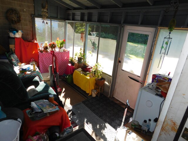 sunroom / solarium with lofted ceiling