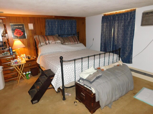 bedroom featuring wood walls and carpet floors