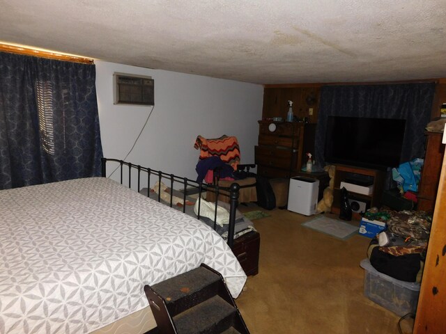 carpeted bedroom with a textured ceiling and an AC wall unit