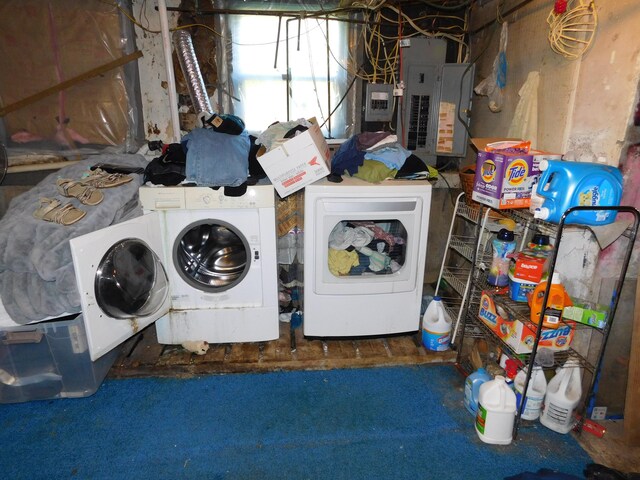 laundry room with separate washer and dryer, electric panel, and carpet flooring