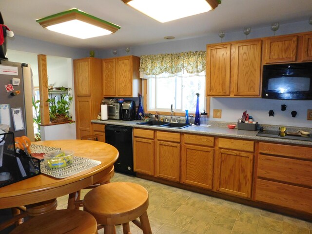 kitchen with black appliances and sink