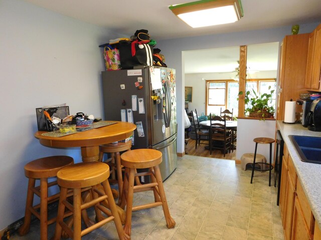 interior space featuring stainless steel fridge