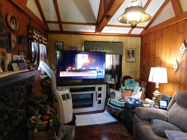 living room with a fireplace, wooden walls, and lofted ceiling with beams