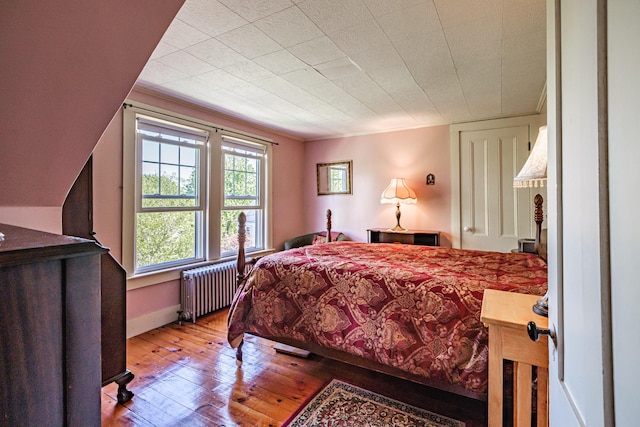 311 Pine St, South Portland, ME 04106 - bedroom featuring radiator, hardwood / wood-style flooring, and baseboards