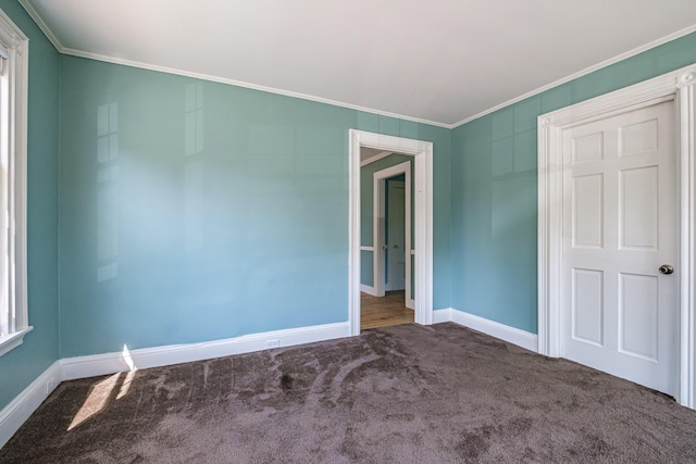 311 Pine St, South Portland, ME 04106 - carpeted empty room featuring ornamental molding and baseboards