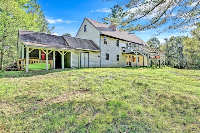 back of house with a yard