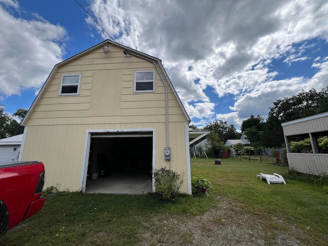 garage featuring a yard