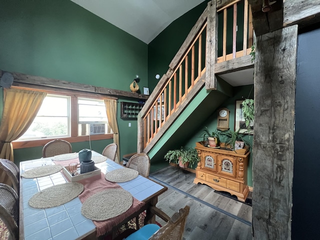 50 Hanover St, Skowhegan, ME 04976 - dining room with wood finished floors, lofted ceiling, stairway, and cooling unit