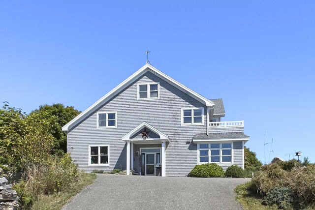 rear view of property with a balcony