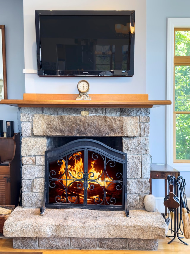 exterior details featuring a fireplace