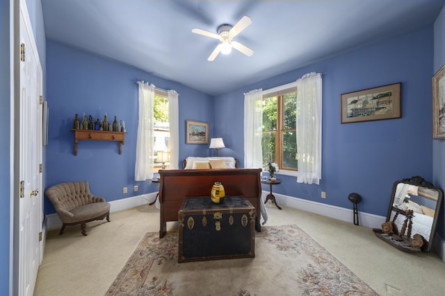 bedroom featuring multiple windows, baseboards, and carpet