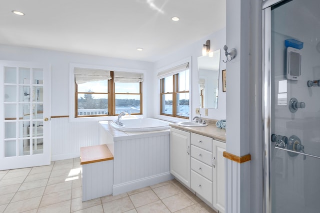 full bathroom with a stall shower, tile patterned floors, recessed lighting, and vanity
