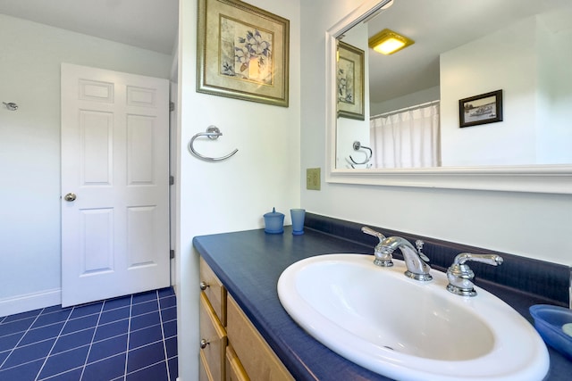 bathroom featuring tile patterned flooring and vanity