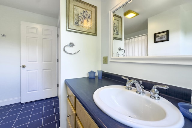 bathroom with tile patterned flooring and vanity
