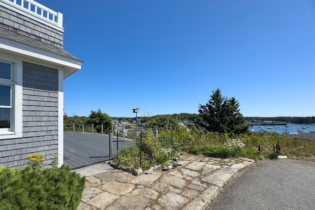 view of patio with a water view