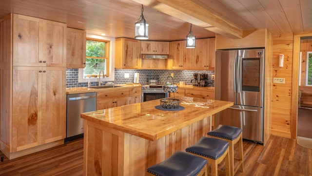 13 S Lucy Way, Greenville, ME 04441 - kitchen with light brown cabinets, a sink, stainless steel appliances, and tasteful backsplash