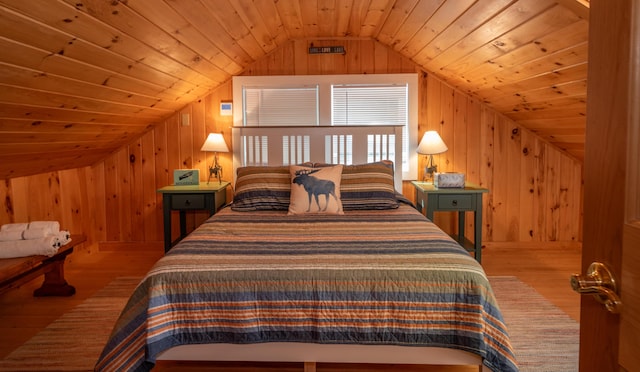 13 S Lucy Way, Greenville, ME 04441 - bedroom with vaulted ceiling, wood finished floors, wood walls, and wooden ceiling