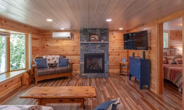 13 S Lucy Way, Greenville, ME 04441 - living room featuring wooden ceiling, wooden walls, a wall mounted air conditioner, a fireplace, and wood finished floors
