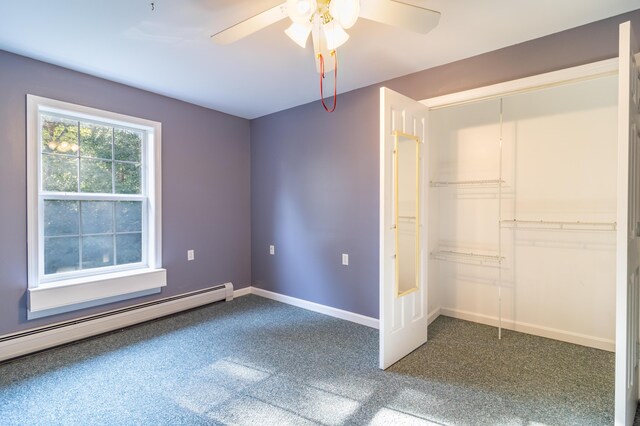 unfurnished bedroom featuring a baseboard heating unit, a closet, and ceiling fan