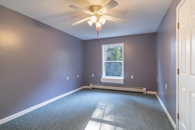 spare room with baseboard heating, carpet, and ceiling fan