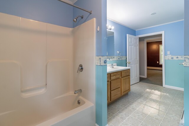 bathroom with vanity, ornamental molding, tile patterned flooring, and shower / bathtub combination