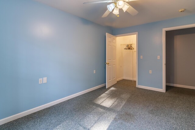 unfurnished bedroom featuring a closet, ceiling fan, and dark carpet