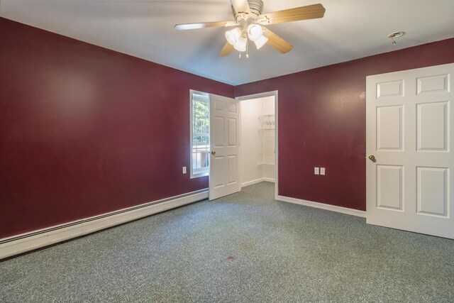 empty room with baseboard heating, carpet floors, and ceiling fan