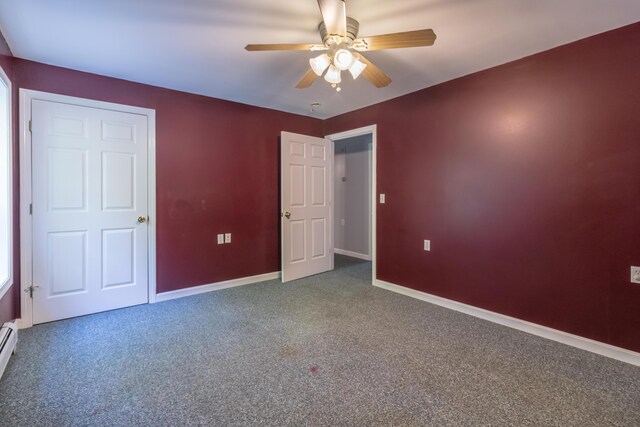 unfurnished bedroom featuring ceiling fan, carpet floors, and baseboard heating