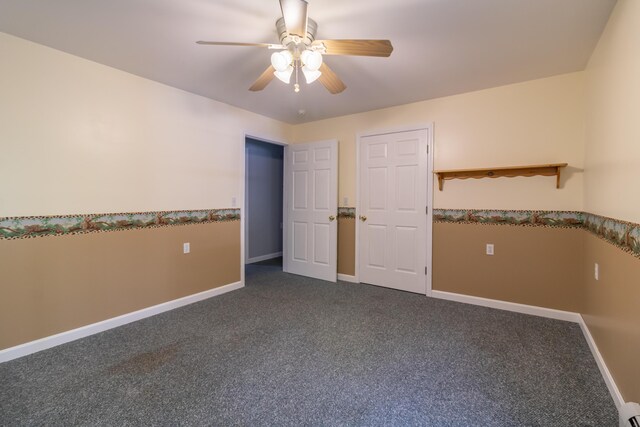 interior space with ceiling fan and carpet