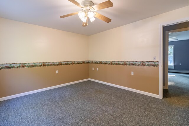 carpeted spare room featuring ceiling fan and a baseboard radiator