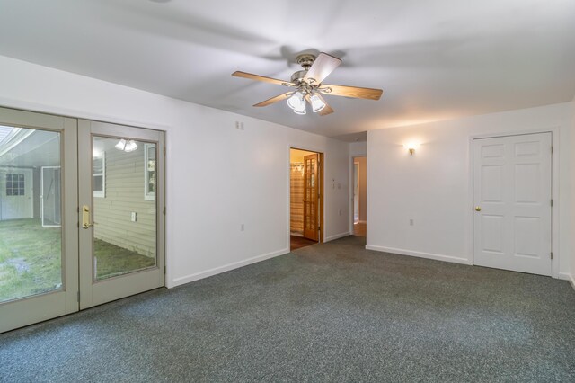 carpeted spare room with french doors and ceiling fan