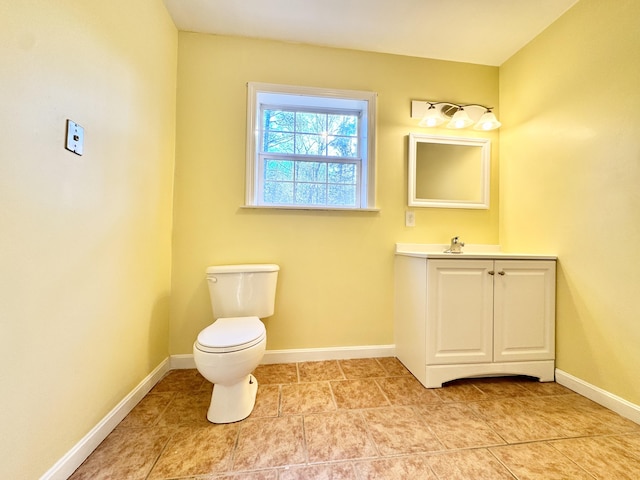 23 Millvale Rd, Bucksport, ME 04416 - bathroom featuring baseboards, toilet, tile patterned flooring, and vanity