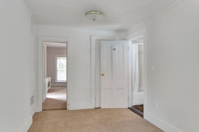 unfurnished bedroom with light carpet and ornamental molding