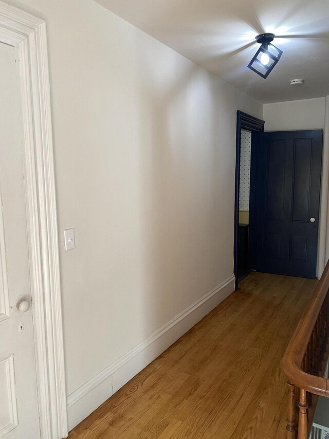 corridor featuring hardwood / wood-style floors