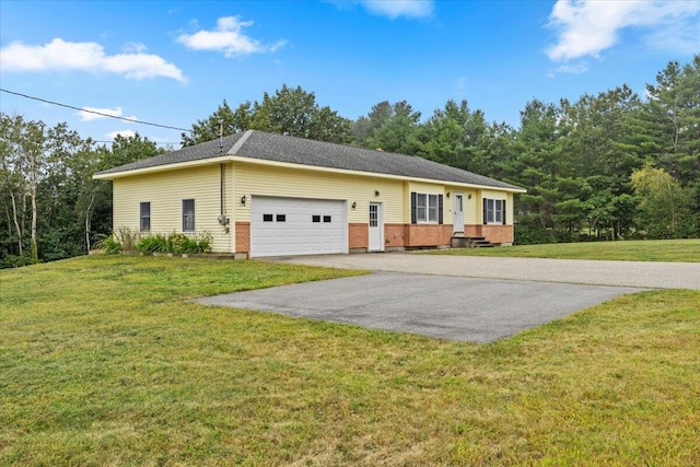 single story home featuring a garage and a front lawn