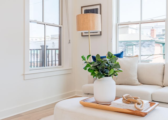 interior space with baseboards and wood finished floors