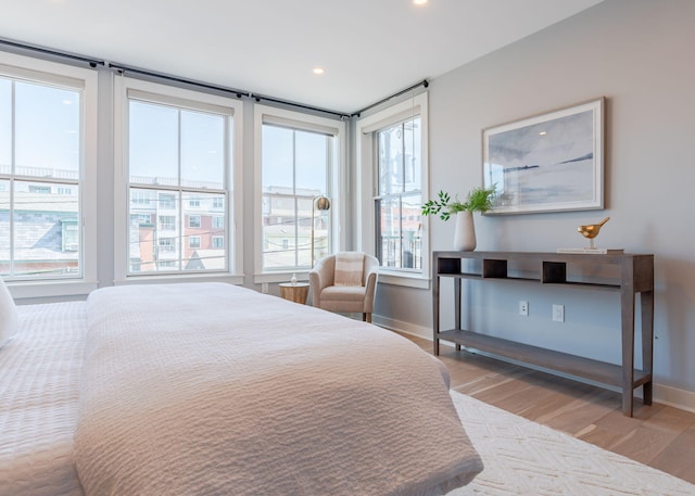 bedroom featuring recessed lighting, baseboards, and light wood finished floors