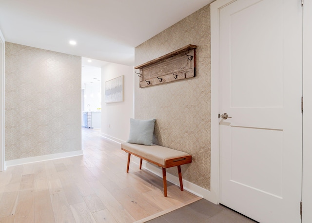 mudroom featuring wallpapered walls, recessed lighting, baseboards, and light wood-type flooring