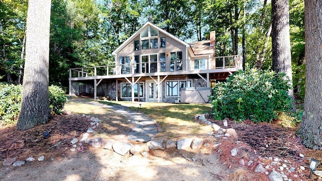 back of property with a wooden deck