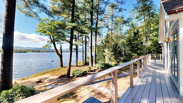 deck featuring a water and mountain view