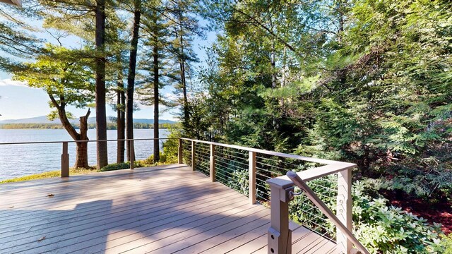 wooden deck with a water view