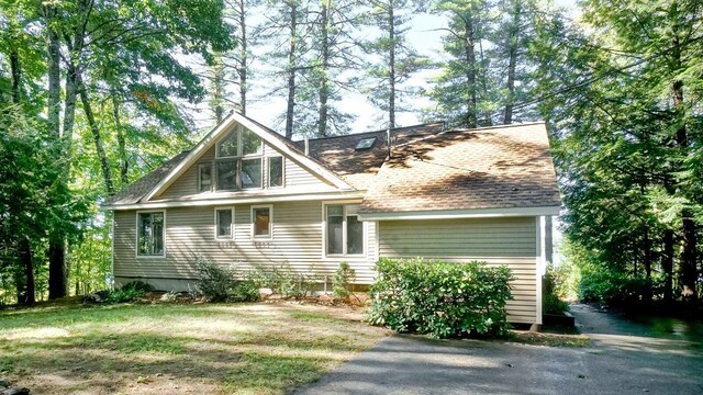 view of property exterior with a yard