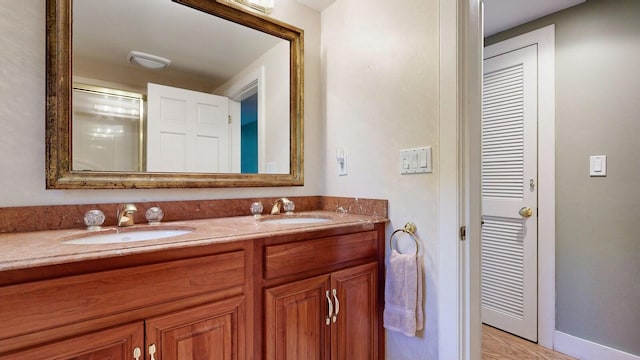 bathroom featuring vanity and wood-type flooring