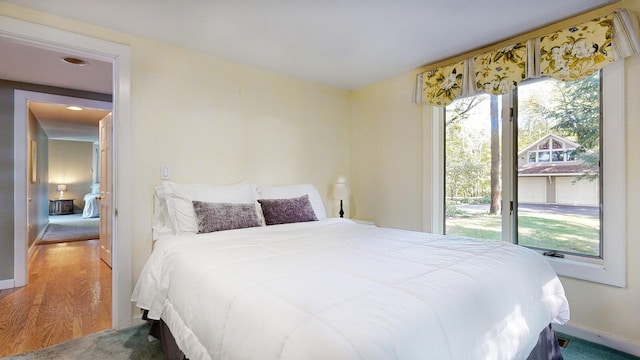 bedroom with hardwood / wood-style floors