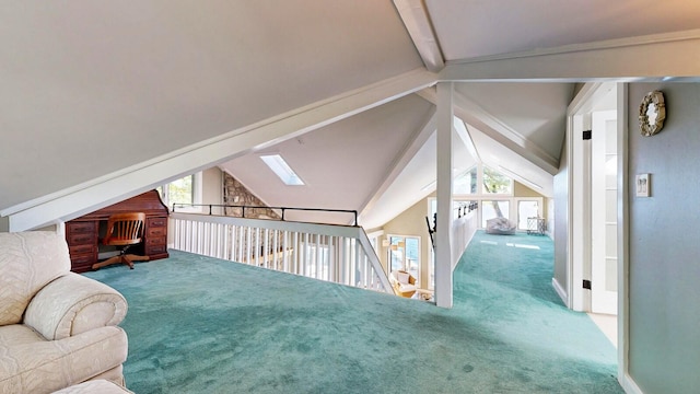 bonus room featuring lofted ceiling with skylight and carpet floors