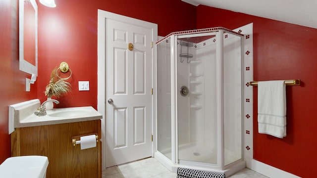 bathroom featuring tile patterned floors, vanity, and a shower with shower door