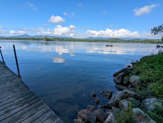 dock area featuring a water and mountain view