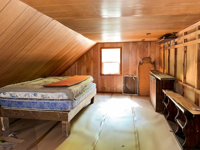 bedroom featuring vaulted ceiling, wood walls, and wooden ceiling