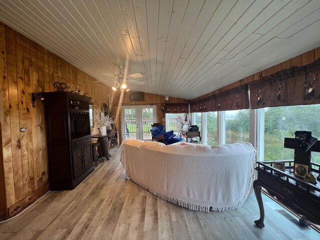 interior space with ceiling fan, lofted ceiling, and wooden ceiling