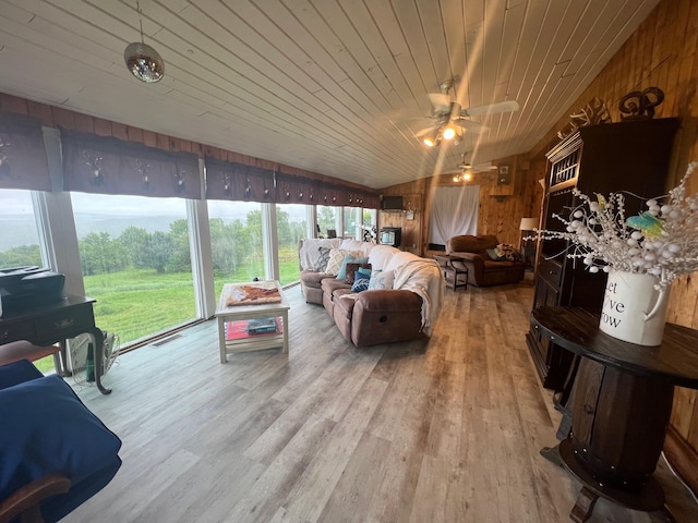 sunroom with wood ceiling, lofted ceiling, and ceiling fan